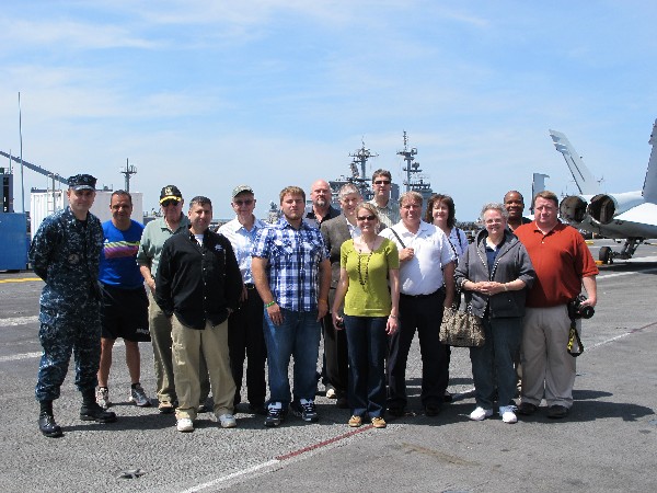 Members of the Hampton Roads and Tidewater chapters join AFCEA International staff for a tour of the USS George H.W. Bush in May.