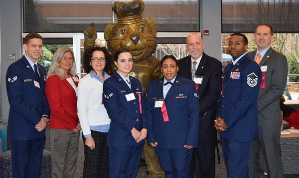 Chapter judges at the 65th Annual Tidewater Science and Engineering Fair in March are (l-r) Pike Pernsteiner; Paula McPhee; Stephanie Luzzi; Erica Finnegan; Taylor Herbert; Rick Beard; Master Sgt. Roshad Mays, USAF; and Scott Wigginton.