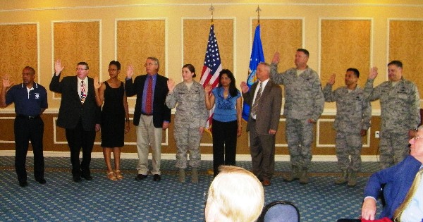 Steve Kelley, regional vice president, installs the upcoming year's chapter Board of Directors in September. Pictured (l-r) are Larry Watlington, Sam Moore, Valerie Wilder, Mark Peterson, Kylie Subjinske, Makeva Flowers, Randy Martin, Chief Master Sgt. Anthony Wheeler, USAF, Master Sgt. Elias Garcia, USAF, and Col. Rick Folks, USAF.