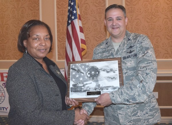 Col. Folks presents Lynne Mills, AFCEAN of the Month, August 2014, an award for her outstanding support for the chapter's social events at the November luncheon.
