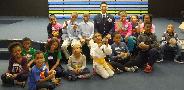 Master Sgt. Garcia, the chapter's science, technology, engineering and mathematics (STEM) director, joins students who participated in the May event.
