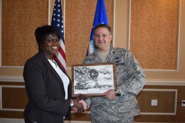Doris Hawkes of Air Combat Command's Computer Systems Squadron was selected as AFCEAN of the Month for February. Chapter President Col. Rick Folks, USAF, presents her a plaque at the May luncheon.