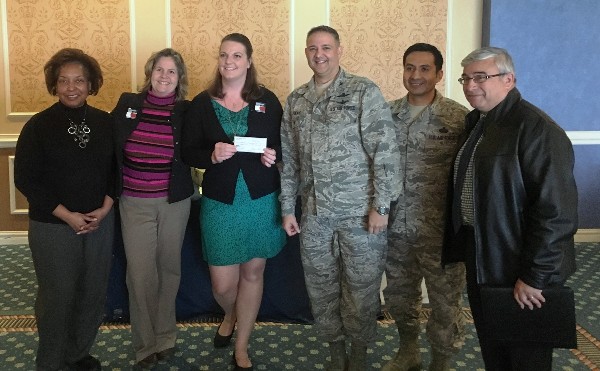 (l-r) Heather Price (c), PTA president of Bethel Manor Elementary School, accepts the chapter's donation along with (l-r) Lynne Mills, chapter STEM liaison; Susan Willard, education technology facilitator; Col. Folks; Master Sgt. Elias Garcia, USAF, STEM director; and Anthoney Stoney, Spectrum Corp. at the luncheon in February.  