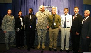 Recognizing chapter scholarship winners during the Joint Warfighting Conference in May are (l-r) Maj. Ramsamooj Reyes, USAF, chapter board of directors; Makeva Flowers; Jaymes Berry, scholarship winner; Gen. Raymond T. Odierno, USA, U.S. Joint Forces Command; Patrick Godwin, scholarship winner; Dillon Gresham, scholarship winner; Marion; and Lt. Gen. John Dubia, USA (Ret.), executive vice president of AFCEA International.