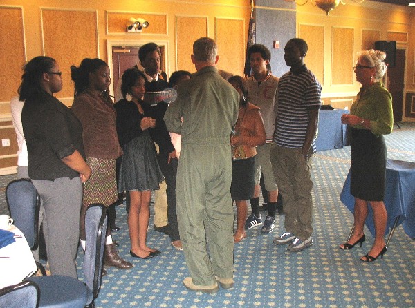 Gen. Hostage (c) welcomes a group of students from the Newport News Achievable Dream Academy to the chapter's event in April. Achievable Dream is a nonprofit, year-round, extended day public school born out of the belief that all children can learn and succeed regardless of their socioeconomic backgrounds.