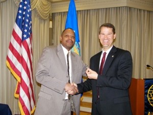 Forace McDaniel (l), ACC/A6CK, receives the chapter's February AFCEAN of the Month award from Marion for his outstanding service as the chapter's webmaster.