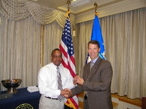 Marion (r) recognizes Larry Watlington as the AFCEAN of the Month at the March meeting.