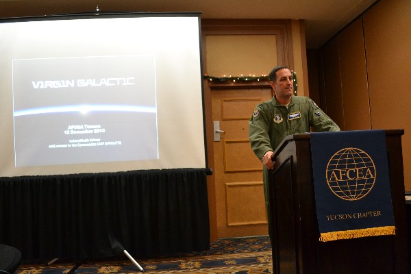 Col. Keith Colmer, USAF, Air National Guard adviser to the commander, 12th Air Force (Air Forces Southern), presents on engineering design and simulation for Virgin Galactic during the chapter's December luncheon. Col. Colmer is an Air Force test pilot and was hired by Virgin Galactic to pilot its White Knight 2 and Spaceship 2 and is currently on military leave.