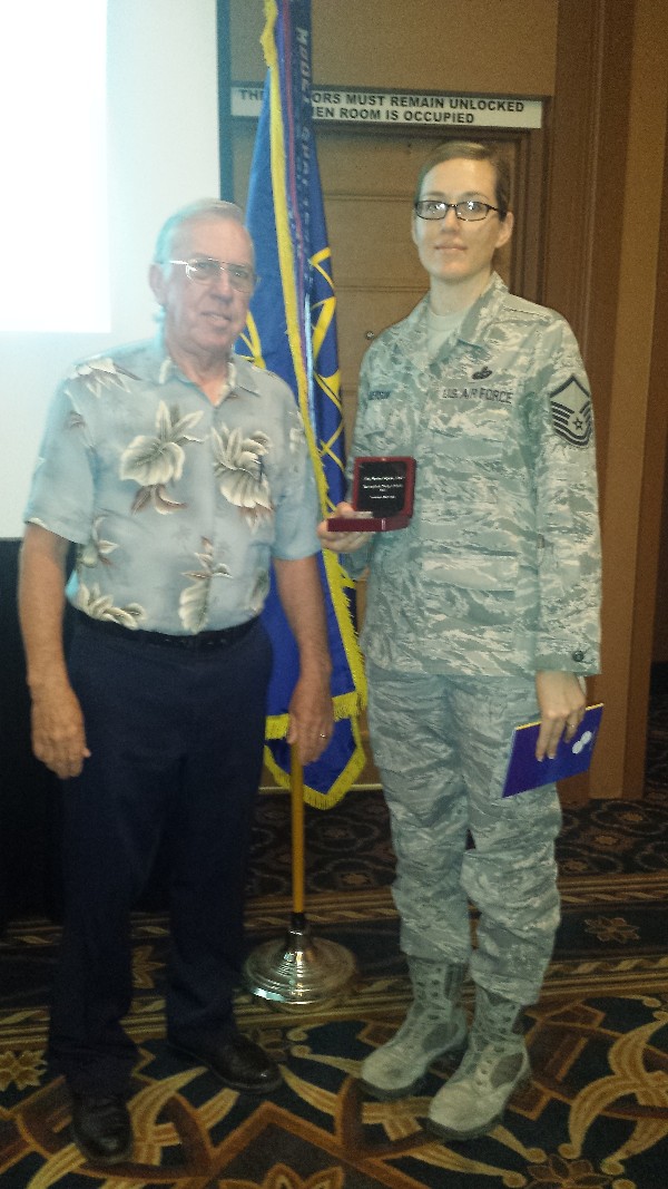 Regional Vice President Larry Bingaman presents the AFCEA International Distinguished Young AFCEAN Award to Master Sgt. Wendee Roberson, USAF, in April. Master Sgt. Roberson serves as the chapter vice president, enlisted affairs, and is a mentor to many in the realm of information assurance and cybersecurity.