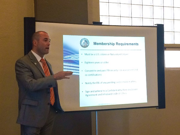 Bryn Tierney speaks about the requirements to be a member of InfraGard, a partnership between the FBI and the private sector, at the September luncheon.