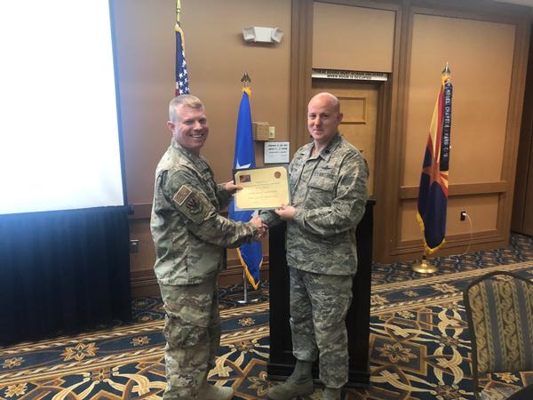 Lt. Col. Joseph Watson, USAF, chapter executive vice president, presents Maj. Gen. Andrew Croft, USAF, commander, 12th Air Force (Air Forces Southern), Davis-Monthan Air Force Base, Arizona, with a certificate of appreciation for speaking at the February Professional Development Luncheon. 
