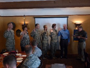 In May, Larry Bingaman (far r), Southwest regional vice president, swears in the chapter's new board of directors (l-r): Senior Master Sgt. Douglas Fugett, USAF; Geri Smith; Capt. Patrick Tibbals, USAF; Capt. Gabriel Avilla, USAF; Col. Susan Kumashiro, USAF; and Tom Flannery, chapter president.