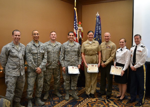 Chapter leaders, ROTC instructors and recipients of the chapter's Armed Forces Leadership in Technology Award together in December are (l-r) Capt. Matt Kahley, USAF, vice president for Young AFCEANs; Maj. Brian Sroufe, USAF, chapter president; Maj. Keith Moreno, USAF; Cadet Alejandro Castanos, Air Force ROTC, scholarship recipient; Midshipman Lauren Morford, Navy ROTC, scholarship recipient; Col. Michael Kuhn, USMC; Cadet Anna VanCleave, Army ROTC, scholarship recipient; and Lt. Col. Benjamin Walters, USA.