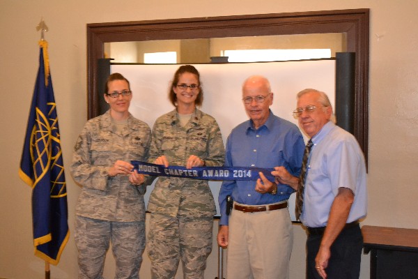 Members of the chapter board of directors receive their third consecutive Model Chapter Award during the September Chapter luncheon. From l-r: Master Sgt. Wendee Roberson, USAF, vice president, enlisted affairs; Capt. Stacie Voorhees, USAF, vice president, programs; Tom Flannery, executive vice president; and Larry Bingaman, vice president, Southwest Region.