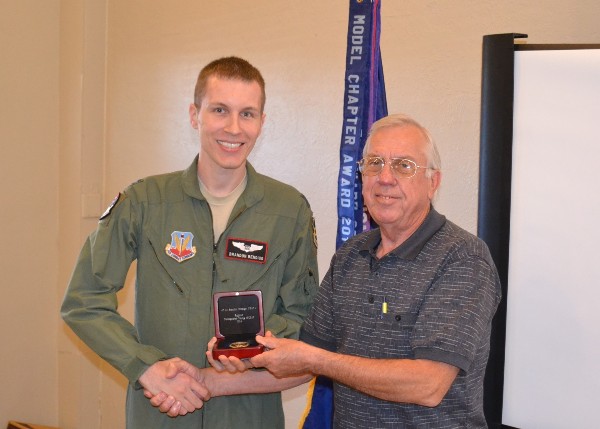 Capt. Brandon Bendigo, USAF, chapter vice president for Young AFCEANs, receives recognition as the Regional Distinguished Young AFCEAN from Larry Bingaman, southwest regional vice president, during the February chapter luncheon.