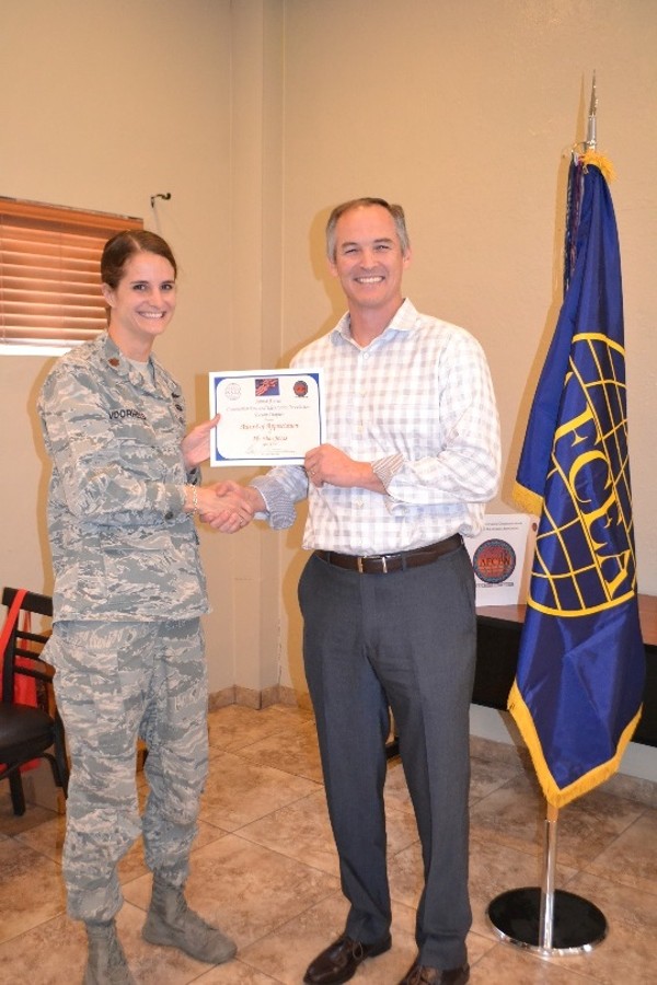 Maj. Stacie Voorhees, USAF, chapter vice president programs, thanks Lt. Col. Dan Jones, USAF (Ret.), CEO, Beyond Horizons Space Consulting and Spark Connect Inc., for his presentation in April on leadership and local and global science, technology, engineering, arts and mathematics (STEAM) collaboration. 