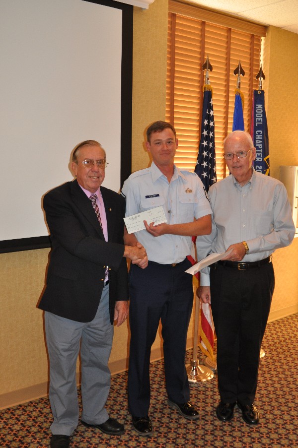In November, Bingaman (l) presents a check for $6,000 on behalf of AFCEA International to Sgt. Nielsen and Flannery. The funds recognize the chapter's support to the March 2012 TechNet Land Forces Southwest Conference.
