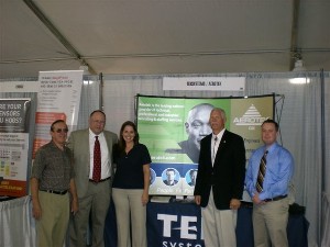 Larry Bingaman (l), chapter treasurer; Sean McGowan (2nd from l), manager of chapter and member programs, AFCEA International; Gena Cairns (c),chapter vice president for membership; Dave Grundies (2nd from r), regional vice president; and Jonathan Howell (r), Tek Systems, discuss the October luncheon's presentation. 
