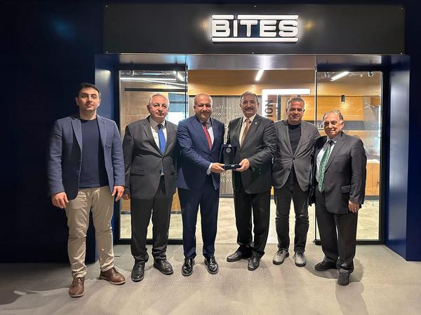 In April, Chapter President Kamil Zafer Selcuk presents a memory plaquette of his visit to BITES General Manager Cemil Sagiroglu.