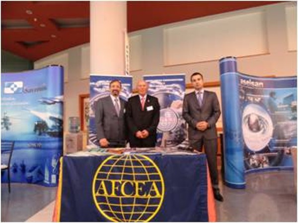 Managing the chapter's booth at the September exhibition are (l-r) Capt. K. Zafer Selcuk, TUN (Ret.), chapter secretary; Col. Buyukoner; and M. Yasar Ercan, chapter board of directors.