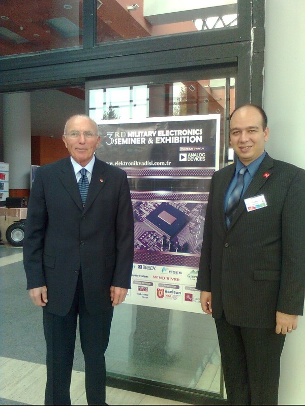 Col. I. Bora Buyukoner, TUA (Ret.) (l), chapter president, and Dr. Arif E. Erkoca, chapter member, work the registration table for the November Military Electronics Systems Seminar and Exposition.