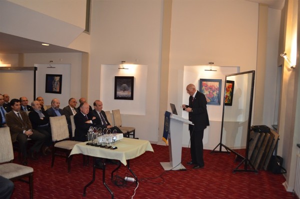 Col. I. Bora Buyukoner, TUA (Ret.), chapter president, makes his opening speech during the December celebration. 