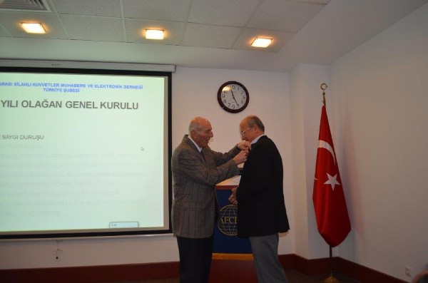 In January, Col. I. Bora Buyukoner, TUA (Retd.), chapter president, presents a 25-year membership pin to Ugur Karavelioglu, who has been a member of AFCEA since September 19, 1988.