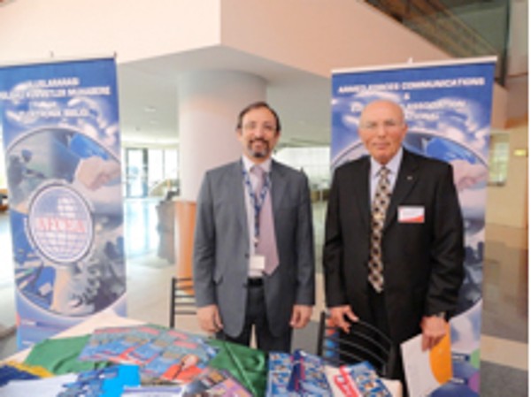 Capt. K. Zafer Selcuk, TUN (Ret.) (l), chapter secretary, and Col. I. Bora Buyukoner, TUA (Ret.), chapter president, manage the chapter's exhibit at the TAI 6th Aviation and Avionics Systems Seminar and Exposition in May.