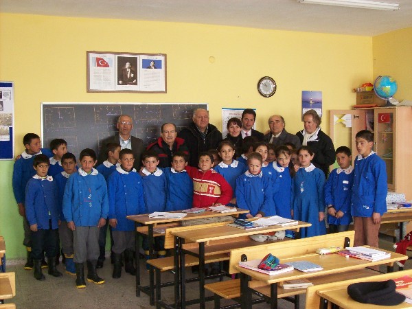 Students at Alisofu Koyu Ilkogretim Okulu elementary school gather following the presentation of a chapter STEM Award, which will improve the school's science program.