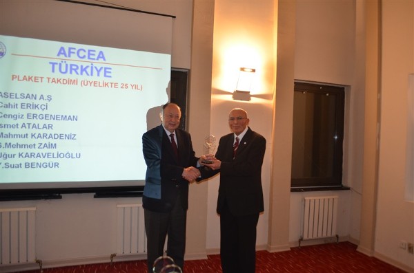 At the December event, Col. Buyukoner (r) presents a plaque to Cengiz Ergeneman, who has been an individual member of AFCEA since September 19, 1988.