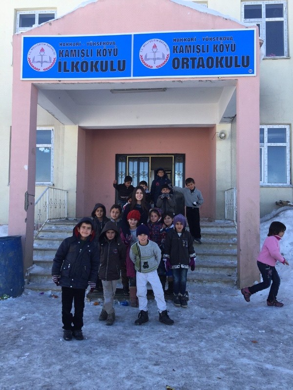 Cihan and her third-grade students stand in front of the school in February . The STEM Award will help buy teaching tools.