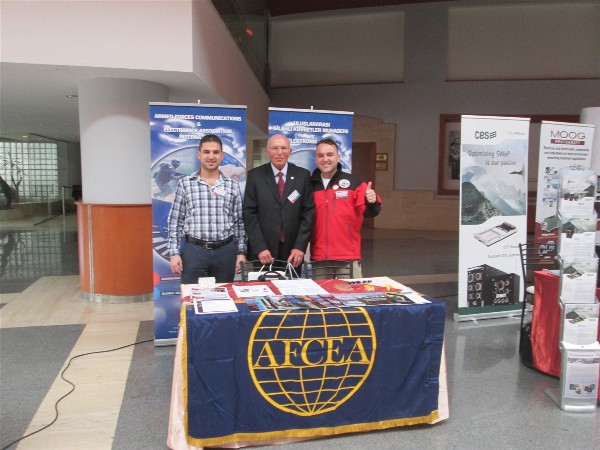 (l-r) 1st Lt. O. Murat Eryasar, TUG, logistic command, Col. Buyukoner and 1st Lt. Ali Kilinc, TUG, logistic command, stand ready to answer questions at the chapter booth at the 4th Military Electronics Systems Seminar and Exposition in January. 