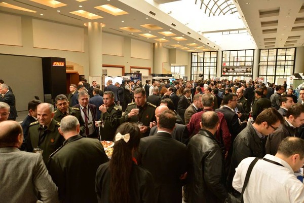 Members of the government, military, industry and academia mingle in the exhibition hall during the 3rd Land Systems Seminar and Exposition in November.