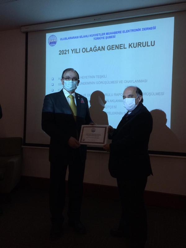 In March, Capt. Selcuk (l) presents a certificate of appreciation to Capt. Alaattin Zafer Betoner, TUN (Ret.), founder of the Turkish Defense Industry News Group.