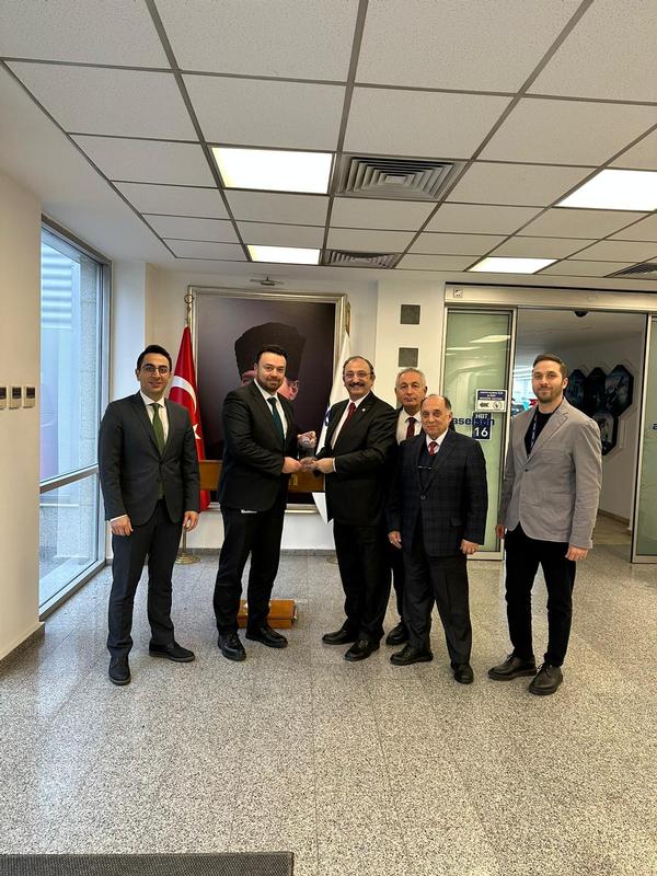 Kamil Zafer Selcuk, chapter president, presents a visit plaque to Yaman in December.