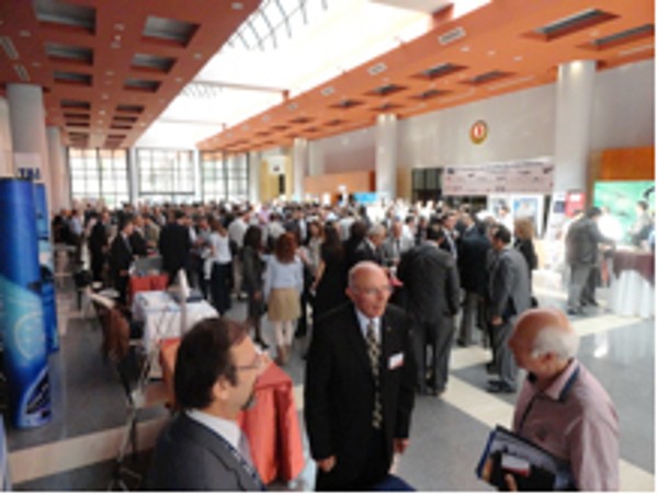In May, Capt. Selcuk (l) and Col. Buyukoner (c) present information about AFCEA to an attendee of the TAI 6th Aviation and Avionics Systems Seminar and Exposition.