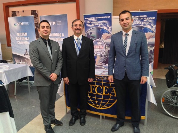Manning the chapter's booth at the seminar in October are (l-r) Seyfettin Sunger, Capt. K. Zafer Selcuk, TUN (Ret.), chapter secretary, and M. Yasar Ercan.