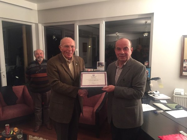 Col. Buyukoner presents a certificate of appreciation to guest speaker Karadeniz at the January event.