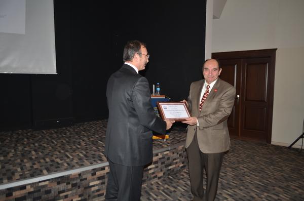 At the March meeting, Capt. Selcuk (l) presents a certificate of appreciation to Serdar Erkoca, managing director, Afuzion Inc., for his support.