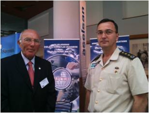 Col. Buyukoner (l) gives information about AFCEA to Col. Yakup Colak, TUA, branch chief of the Communications, Electronics and Information Systems Department of the Turkish Land Forces Command, in September. 
