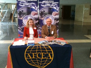 Promoting AFCEA at the chapter's exhibit in March are Esra Erkan (l), chapter board member, and Col. I. Bora Buyukoner, TUA (Ret.), chapter president.