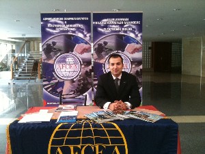 M. Yasar Ercan, chapter board member and Young AFCEAN adviser, assists at the chapter's exhibit in March.