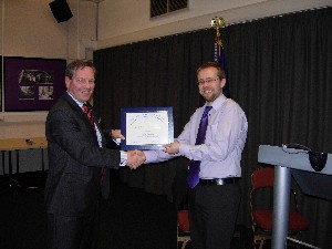 Col. Gordon Rafferty, BA, chapter president, presents February guest speaker Greg Moore, Roke Manor Research, with a certificate of appreciation for his insight on network-enabled capabilities.