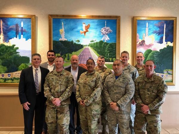 Pausing for a photo at the February meeting (from l-r) are Dan Mathews, chapter vice president of publicity; Brandon Kohler, chapter secretary; Tech Sgt. Jack Leedy, USAF, treasurer; Adam Feingold, regional vice president; Maj. Michelle Williams, USAF; Lt. Col. Fields, USAF, chapter president; Lt. Teddy Barbosa, USAF, vice president of membership; Lt. Col. Patrick Godfrey, USAF; Capt. Huckabee, vice president of operations; and Master Sgt. Jefre Mantlo, USAF.