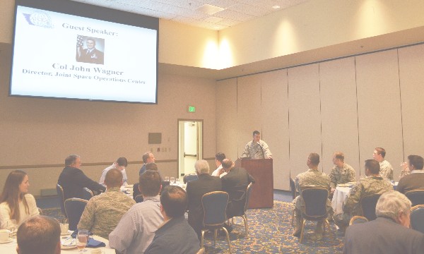 Col. John W. Wagner, USAF, director of the Joint Space Operations Center and commander of the 614th Air and Space Operations Center, addresses the chapter in February. 