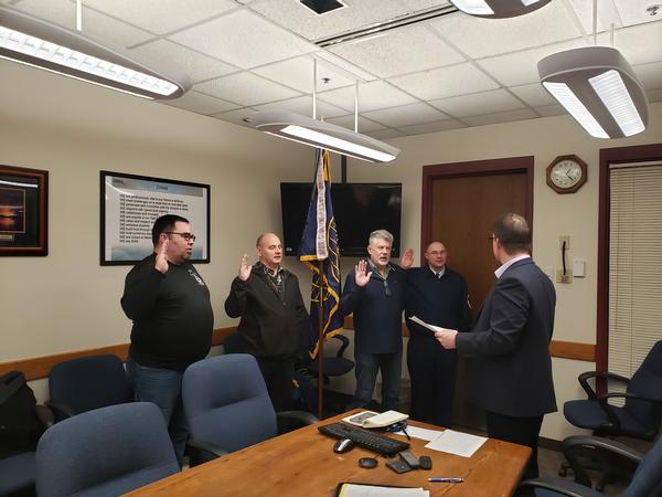 At the December meeting, additional board members (l-r) Chris Flohaug, vice president of scholarships; Woehl, chapter vice president; Scott Warren, vice president of programs; and Senior Master Sgt. William Ceglar, vice president, Military Affairs, are sworn in.