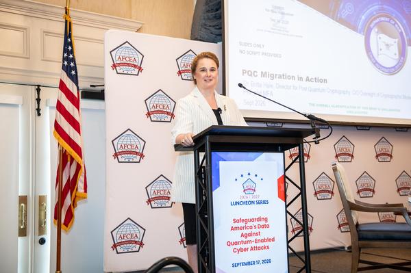Britta Hale, Department of War, delivers her keynote address to the audience in September.