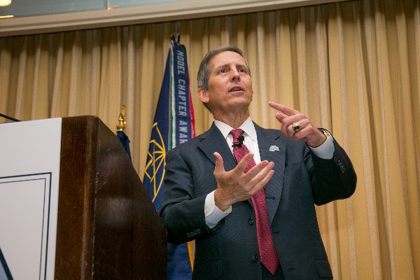 Sloan Gibson, deputy secretary of veterans affairs, speaks at the chapter's Health Summit in July.