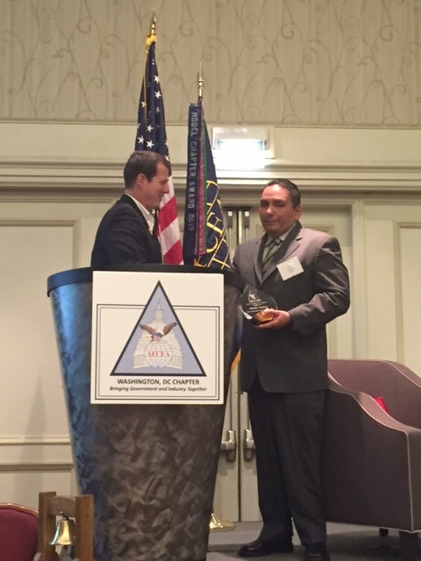 Chapter President Tim Solms (l) recognizes Alfredo Rendon with a science, technology, engineering and mathematics (STEM) teacher award in October.