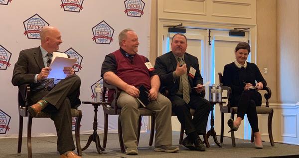 At the March luncheon, panelists (l-r) Dave Mihelcic, former chief technology officer for Defense Information Systems Agency (DISA); John Dollen, U.S. Cyber Command/J-9; John Hale, chief cloud services, DISA; and Ashley Mahan, acting director, General Services Administration, Secure Cloud Portfolio, FedRAMP, address cloud challenges and successes.